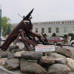 "World's Largest Lobster" at the Tradewinds Motor Inn in Rockland, Maine. The Maine Lighthouse Museum in is the background.