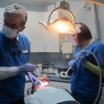 Dr. Medina and Anastasia at work removing extracting teeth #'s 22 and 27.