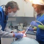 Dr. Medina and Anastasia at work removing extracting teeth #'s 22 and 27.