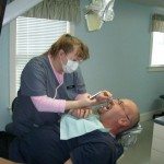 Dara takes photos of the lower mandibular arch.