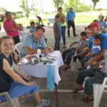 Kami Kay Medina working along side Dr. Matthew Aaron Johnson.