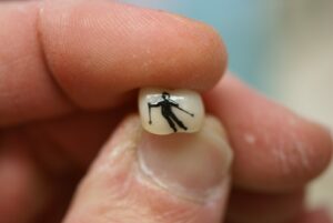 Man Skiing Tooth Tattoo