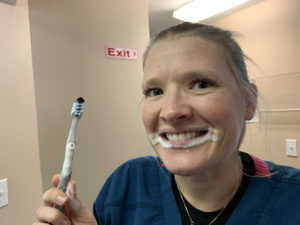 Samantha demonstrating proper oral hygiene techniques